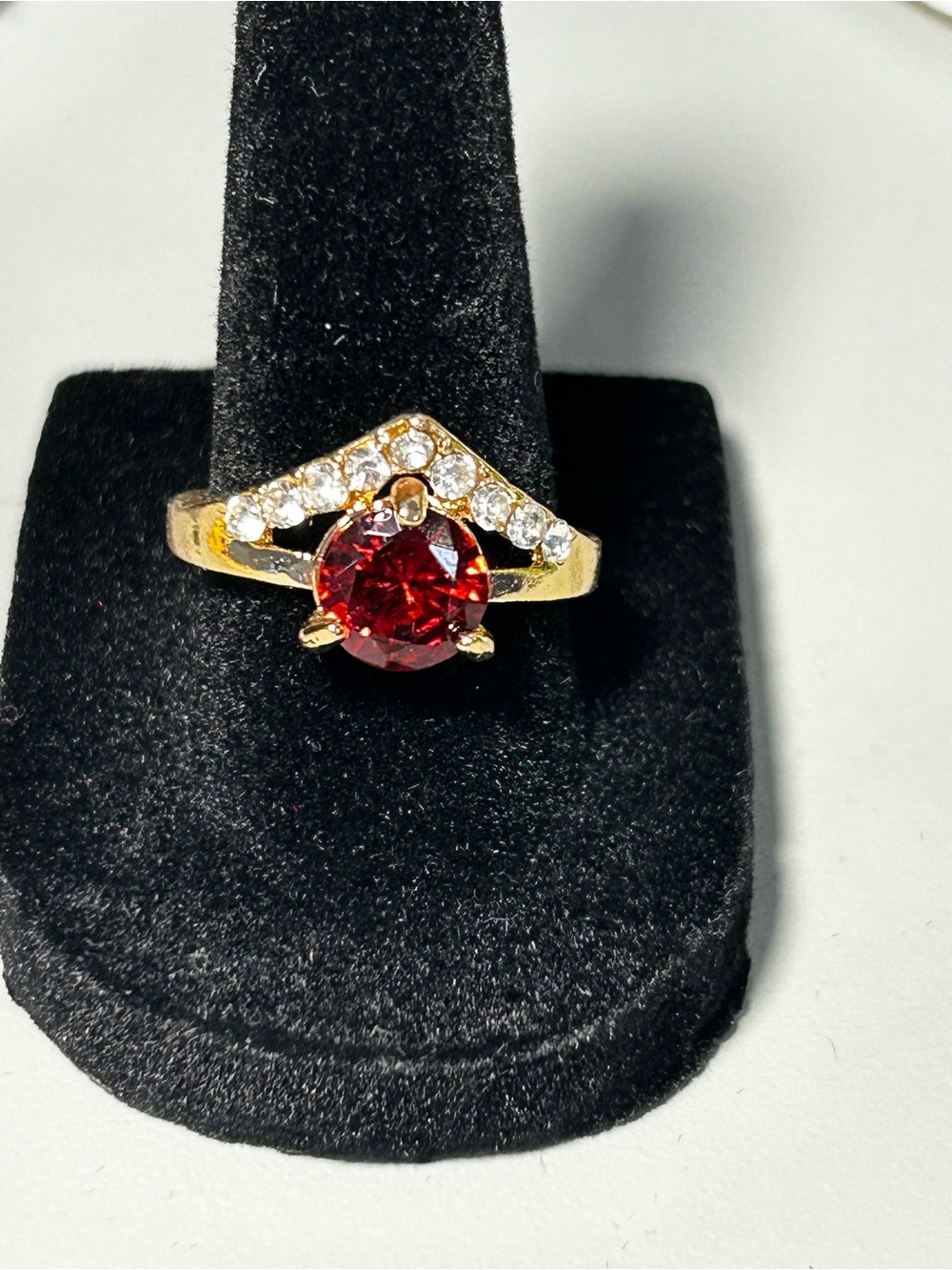 Gold Ring with Red Center Stone and Clear Accents